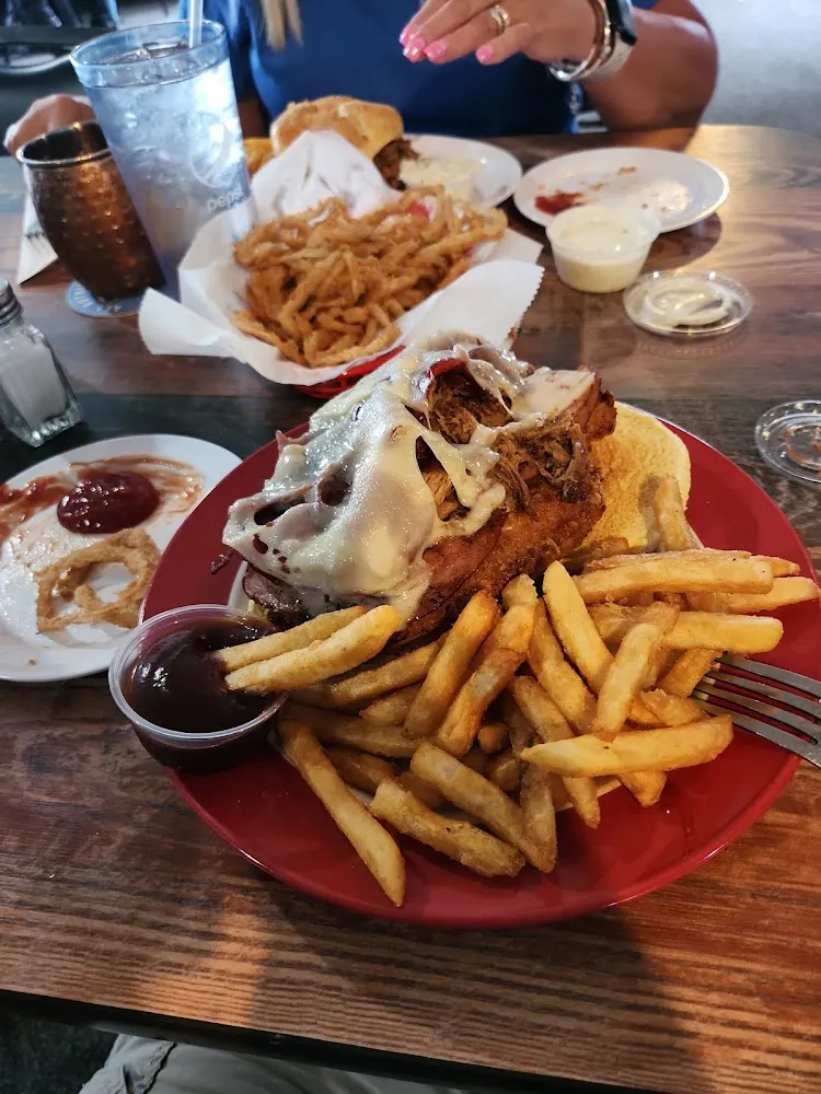 Porkys Revenge Tenderloin Ham Bacon & Pulled Pork Covered in Swiss Cheese